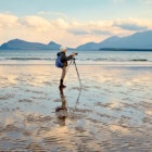 Woman Photographing at Smerwick Harbor during a wonderful sunrise.
1077203902