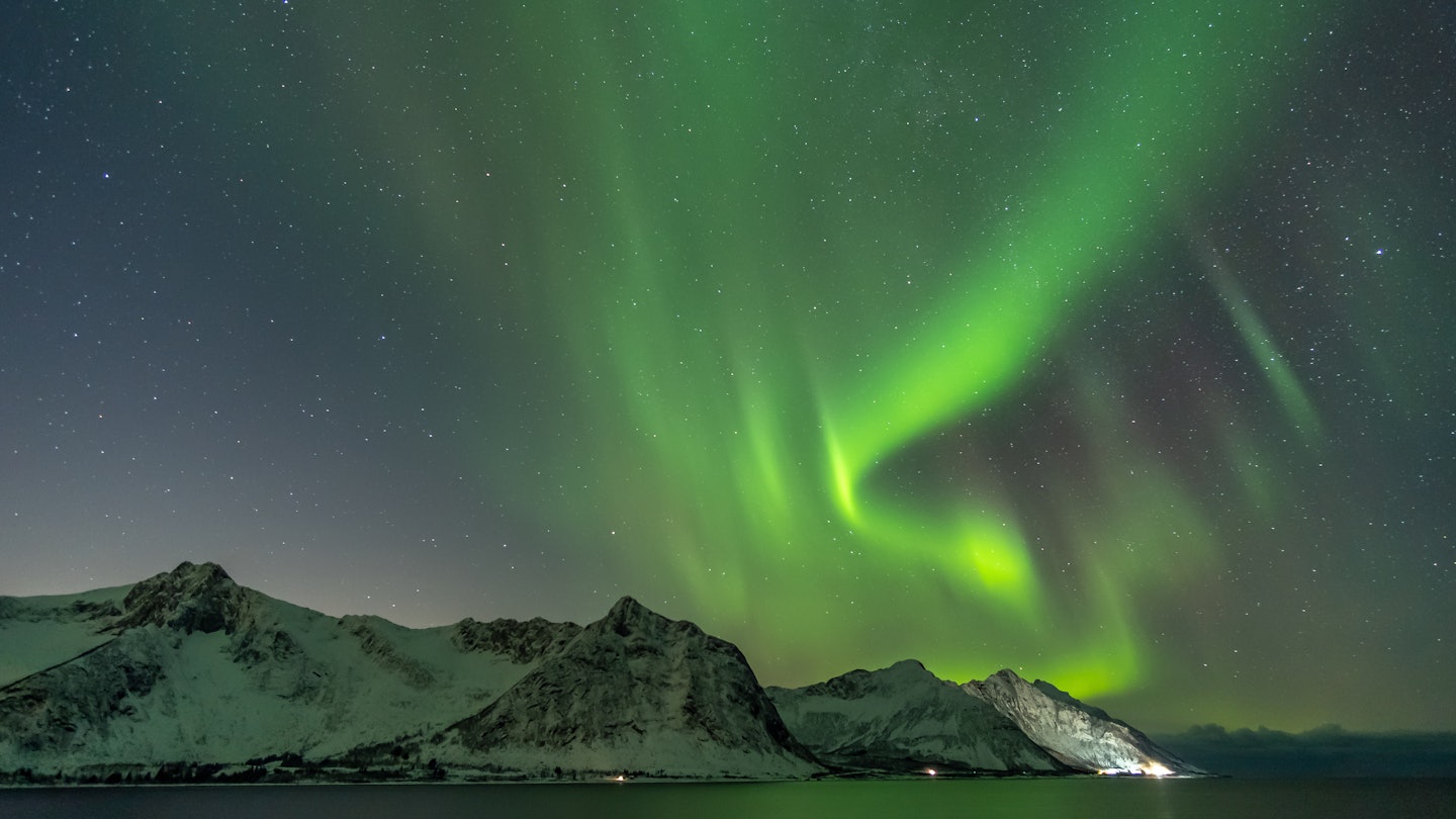 Northern lights, Aurora Borealis, with the Husfjellet mountain, Tungeneset, Senja Island, Troms Norway Europe  License Type: media  Download Time: 2023-08-01T15:50:51.000Z  User: FergalCo  Is Editorial: No  purchase_order:   