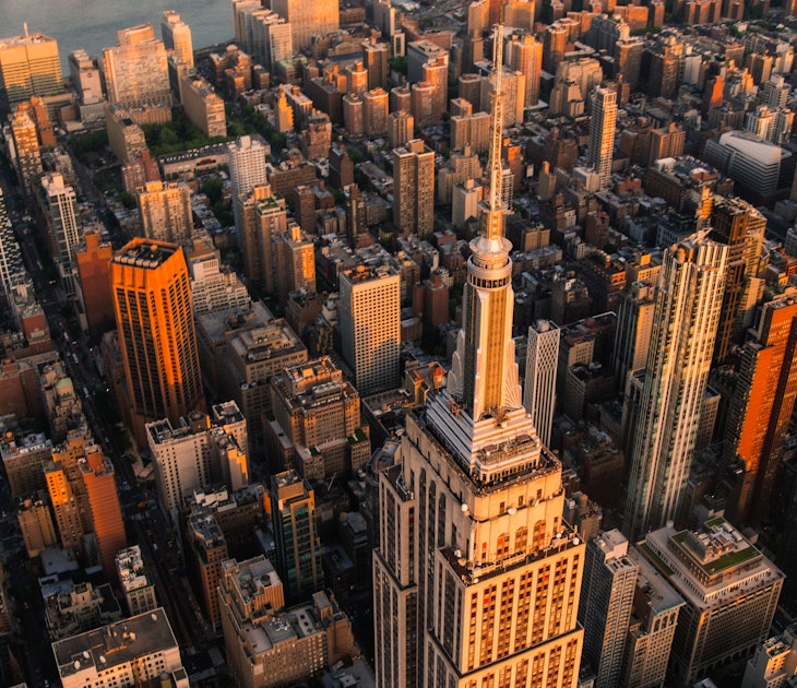 Sunset Aerial View of Empire State Building Spire and a Top Deck Tourist Observatory. New York City Business Center From Above. Helicopter Photo of an Architectural Wonder in Midtown Manhattan, License Type: media, Download Time: 2025-03-30T16:47:19.000Z, User: joe_lp, Editorial: false, purchase_order: 56500 - T&R or Kids, job: Global Publishing WIP, client: The Bugs Book 1, other: Joe Fullman