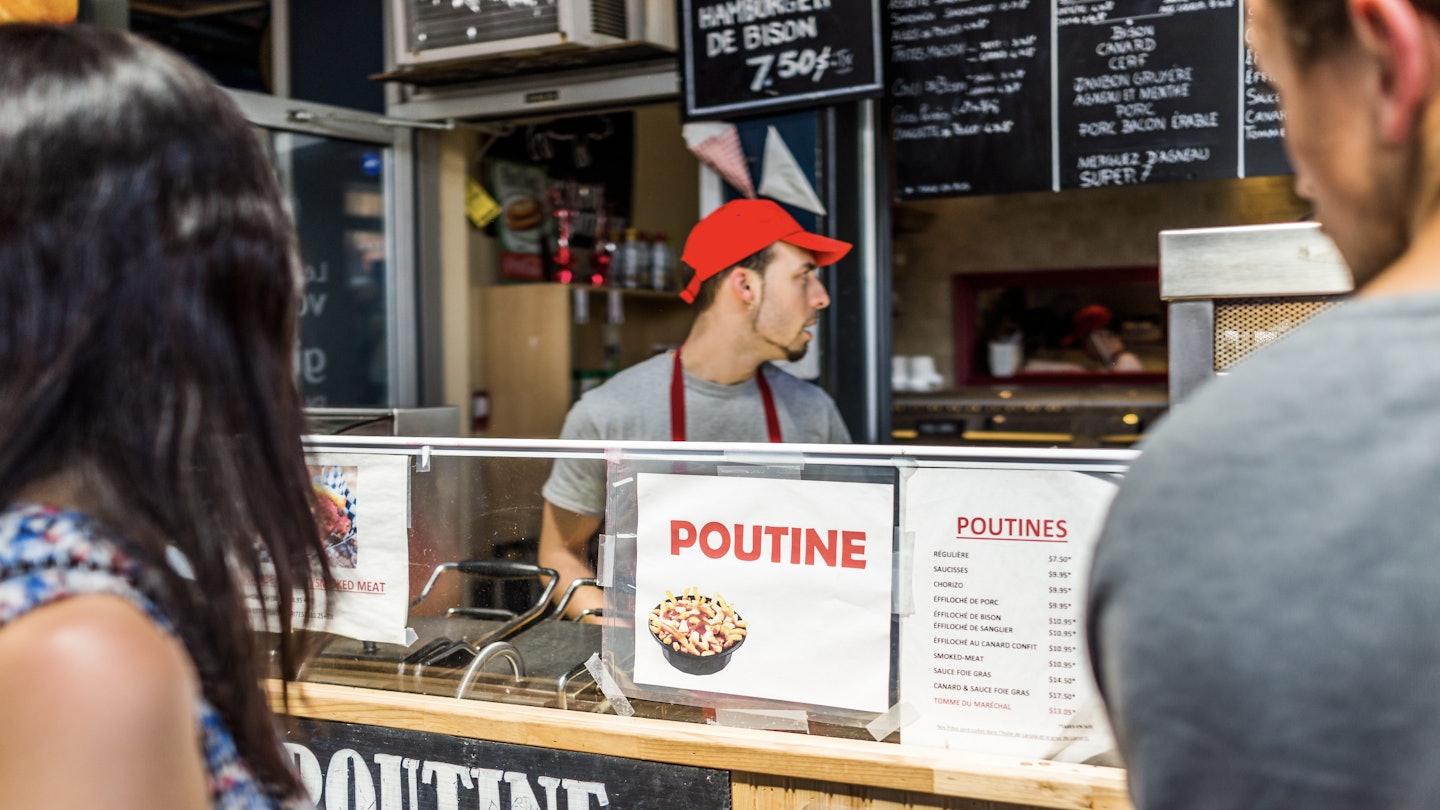 Montreal, Canada - May 28, 2017: Jean Talon market Poutine restaurant sign inside building closeup with chef in city in Quebec region; Shutterstock ID 670090774; purchase_order: 65050 - Digital Destinations and Articles; job: Lonely Planet Online Editorial; client: best poutine in Canada; other: Brian Healy
670090774
architecture, brunch, building, busy, cafe, canada, cheese, chef, city, closeup, color, colorful, curds, downtown, farmer, fast, food, fries, gravy, grocery, inside, interior, jean, jean-talon, lunch, man, many, marche, market, marketplace, menu, montreal, people, place, poutine, quebec, restaurant, sign, street, summer, talon, traditional, urban, young
Jean Talon market Poutine restaurant sign inside building closeup with chef in city in Quebec region