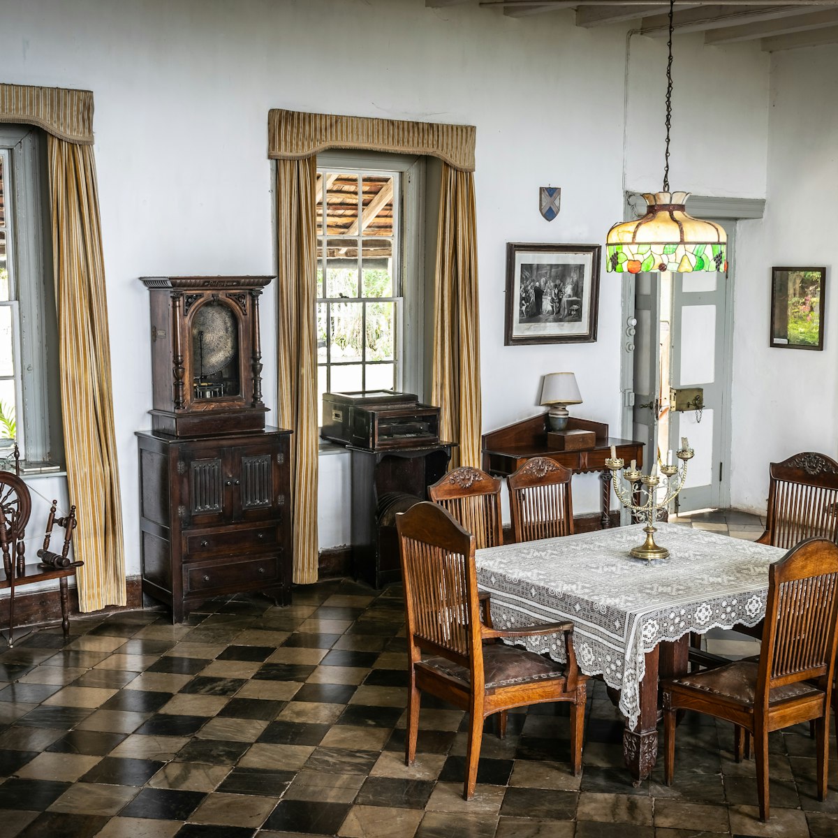 Vintage furniture in dining room area of Greenwood Great House.