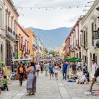 September 16, 2018: Busy pedestrian street in downtown Oaxaca.
1242666148
RFE,  Shutterstock,  architecture,  city,  color,  culture,  elotes,  esquites,  history,  indigenous,  life,  mexican,  mexico,  mezcal,  oaxaca,  old,  people,  street,  tourism,  tourist,  traditional,  travel,  traveler,  best of mexico,  best of oaxaca,  city life,  downtown oaxaca,  mexican flag,  street life,  street vendors,  Adult,  City,  Handbag,  Hat,  Male,  Man,  Neighborhood,  Path,  Person,  Road,  Shoe,  Street,  Urban
Busy pedestrian street in downtown Oaxaca.
